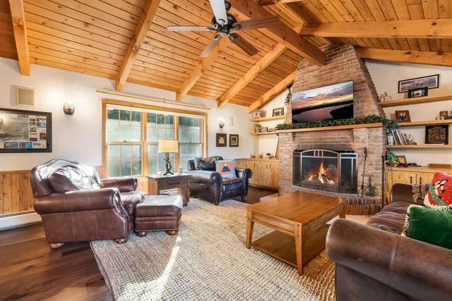 Living room with stone fireplace