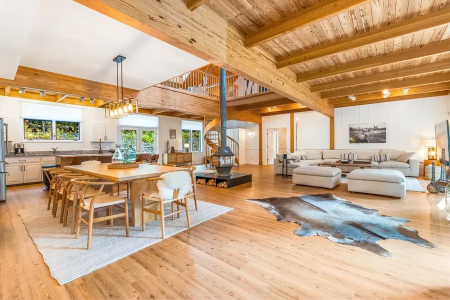 Open-concept living room with wood ceiling